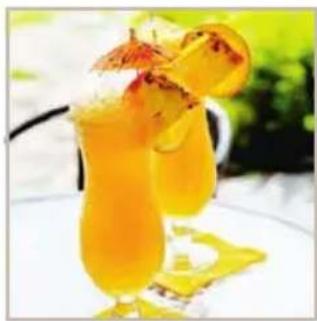 Close-up of a cocktail in a glass with orange juice and garnish, set against a blurred green background (no text or symbols visible)
