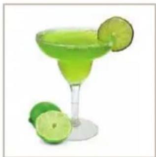 Green margarita glass with lime slices, accompanied by a halved lime (no text or symbols)