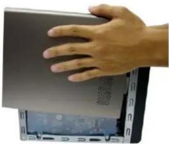 Hand pressing down on a laptop keyboard (no visible text or symbols)