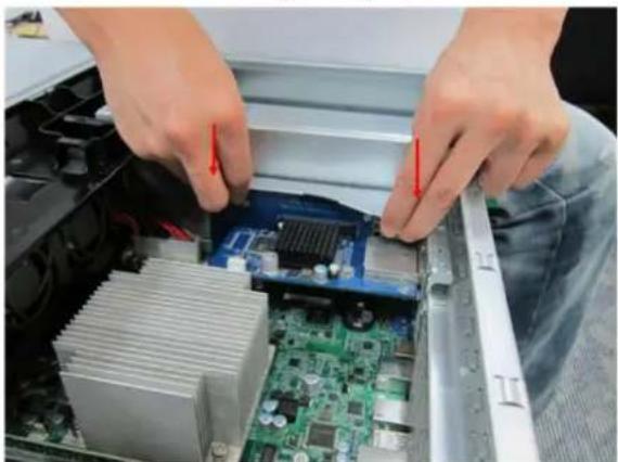 Close-up of hands installing a motherboard with visible CPU socket and cooling unit (no text or symbols)