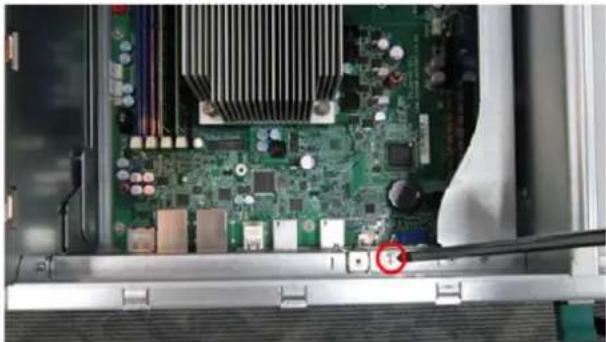 Close-up of an open computer motherboard showing CPU socket, RAM slots, and indicator lights (no text or symbols visible)