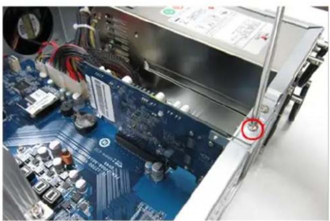 Close-up of an open computer motherboard with visible CPU socket and power supply unit (no text or symbols)