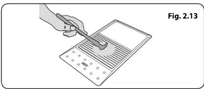 Illustration of a hand using a tool to clean or inspect a grid-patterned device (no text or symbols visible)