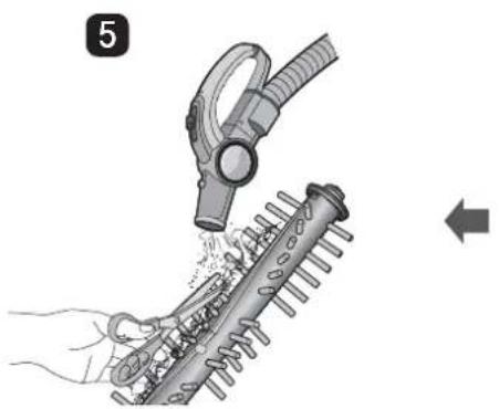 Illustration of a hand using a hairdryer to clean a mechanical component, with no visible text or symbols.