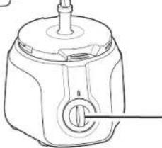 Line drawing of a mechanical device with a central knob and cylindrical body (no text or symbols)