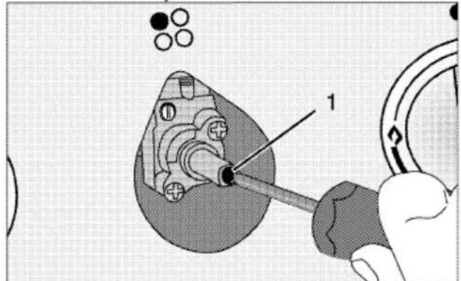 Technical diagram showing a mechanical assembly with labeled component '1' and circular components above, likely illustrating a tool or procedure.