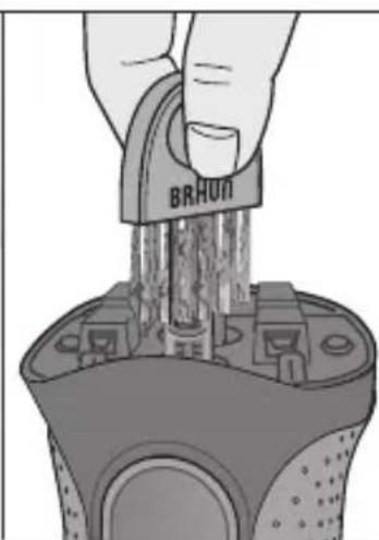 Illustration of a hand inserting a component into a device housing (no text or symbols visible)