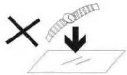 Diagram showing a cross symbol and a downward arrow pointing to a document with a magnified view below, likely indicating a process or annotation.