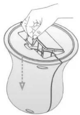 Illustration of a hand placing a small object into a container with arrows indicating direction (no text or symbols)