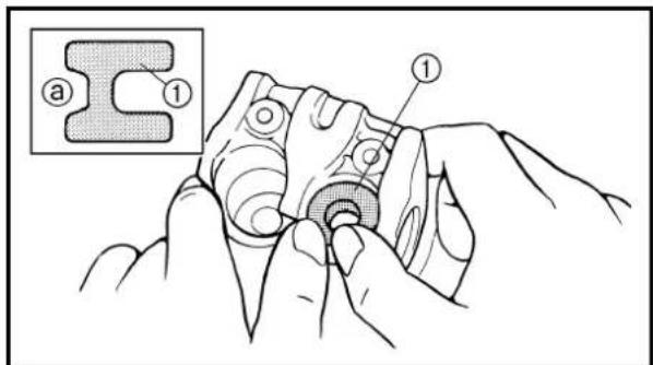 Technical diagram showing a mechanical assembly with labeled parts (a, 1) and a magnified inset view of a mechanical part.