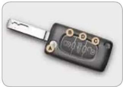 Close-up of a black car key with visible internal components and a metallic handle (no text or symbols)