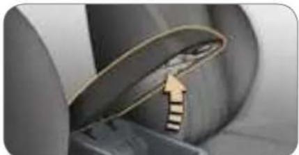 Close-up of a mechanical component with a curved blade and striped handle, no visible text or symbols