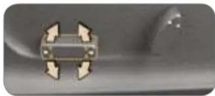 Close-up of a metallic mechanical component with four circular features, no visible text or symbols