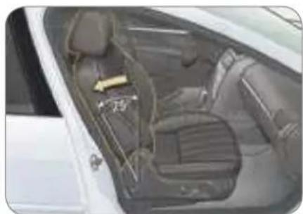 Interior view of a car showing dashboard and seat compartments (no visible text or symbols)