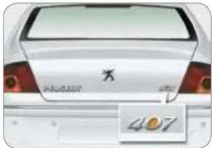 Rear view of a white car with visible brand logo and number 407 (no text or symbols on the car itself)
