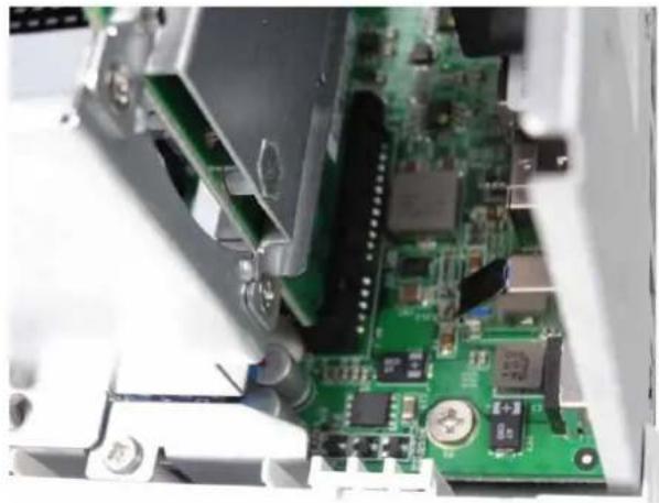 Close-up of a green printed circuit board with visible components and connectors (no text or symbols)