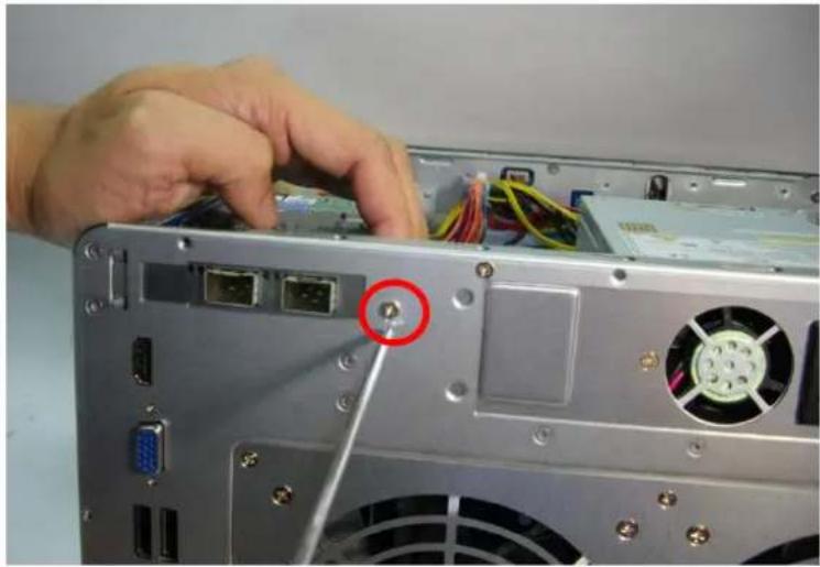 Close-up of a computer tower rear panel showing internal components and cable routing (no visible text or symbols)
