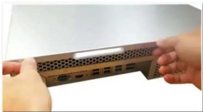 Close-up of hands installing a network packet on a server rack (no visible text or symbols)
