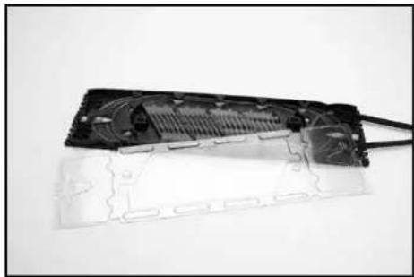 Interior view of a computer monitor case showing internal components and ventilation slots (no text or symbols visible)