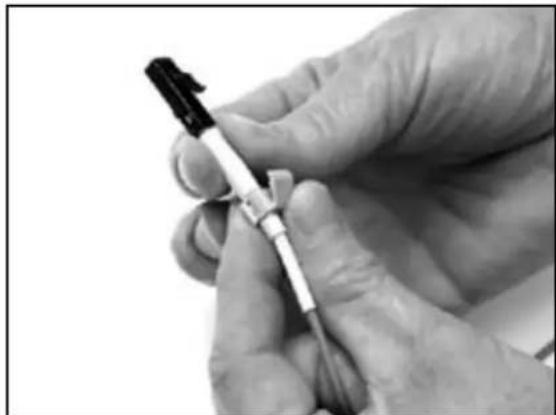 Close-up of a hand holding a medical or laboratory pen, no visible text or symbols