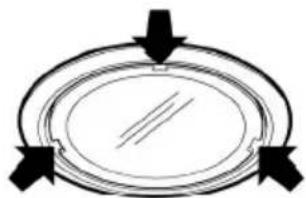 Simple diagram of a circular object with arrows pointing outward, no text or symbols present.