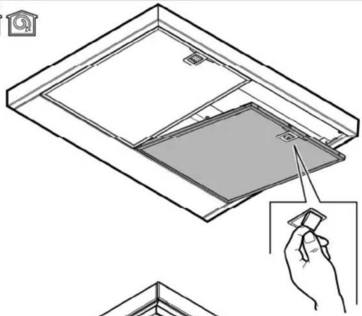 Diagram showing a window frame with a hand inserting a clip into the pan, illustrating installation or cleaning (no text or symbols present)