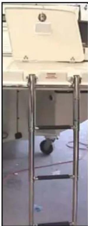 Laboratory equipment setup with a metal ladder and open lid, no visible text or symbols