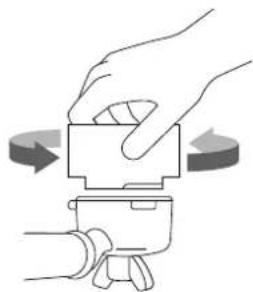 Illustration of a hand pressing a button on a device with directional arrows indicating rotation (no text or symbols)