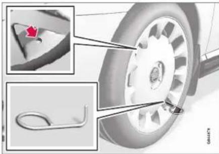 Mechanical component diagram showing a wheel with attached parts and a close-up inset of a red pin (no text or symbols)