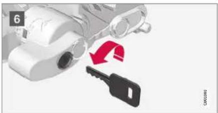 Illustration of a car with a key and red arrow indicating direction (no text or symbols)