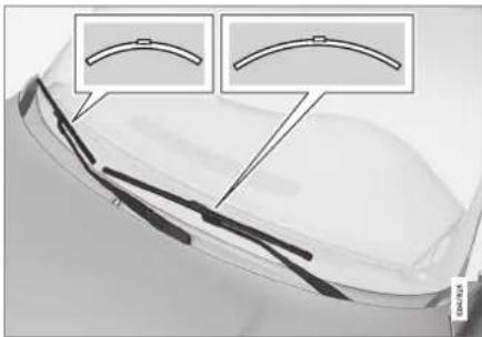 Close-up of a car's side panel with two inset diagrams showing curved components (no text or symbols)