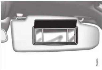Interior view of a car's rearview and dashboard compartment showing the front panel and side door (no text or symbols visible)