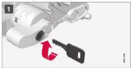 Illustration of a robotic device with a key and red arrow indicating rotation (no text or symbols)