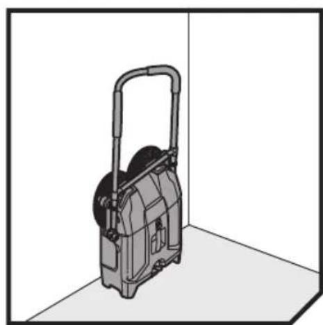 3D rendering of a mechanical device with a handle and wheels, positioned in a corner (no text or symbols visible)