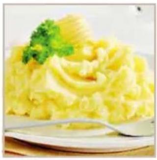 Close-up of a steamed potato dish garnished with parsley, served on a white plate with a fork (no text or symbols visible)