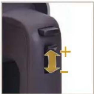 Close-up of a car interior component with directional arrows and plus/minus signs (no text or symbols)