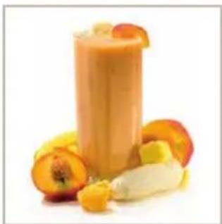 Glass of orange-colored smoothie with sliced fruit and banana slices on a white background (no text or symbols)