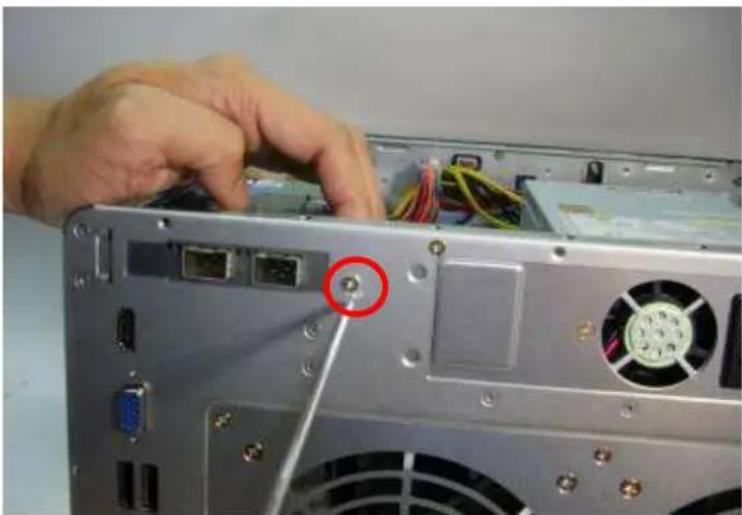 Close-up of a computer tower rear panel showing internal components and cable routing (no visible text or symbols)