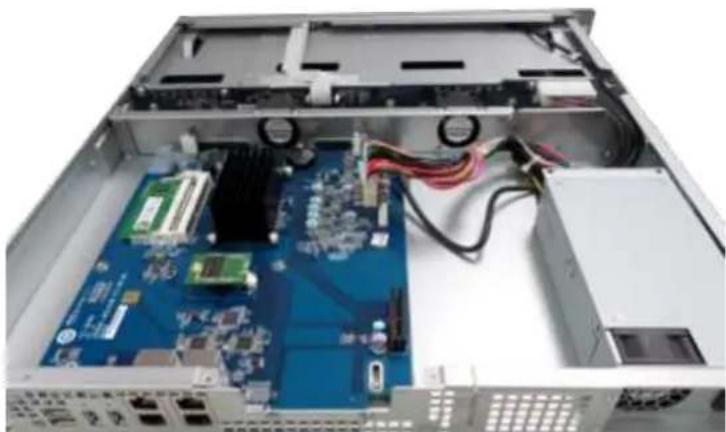 Interior view of a server rack with an open circuit board and internal components (no visible text or symbols)