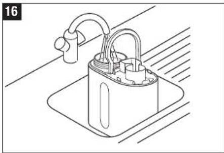 Line drawing of a battery holder with handle and side arm, placed on a surface (no text or symbols)