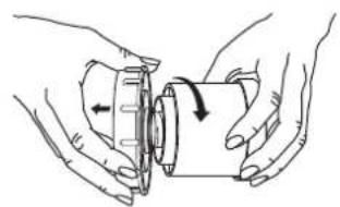 Illustration of hands holding a mechanical component with an arrow indicating rotation (no text or symbols)