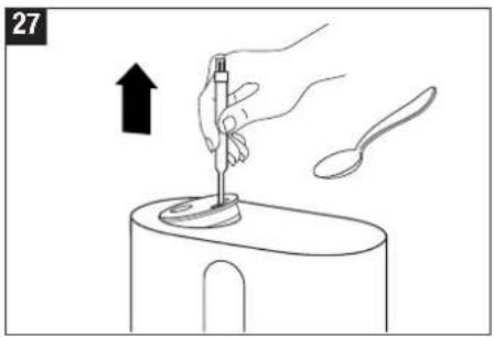 Illustration of a hand using a spoon to press a small object on a surface, with an arrow indicating upward motion (no text or symbols)