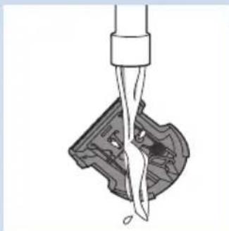 Diagram of a mechanical component being inserted into a housing (no text or symbols visible).