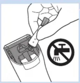Illustration of a hand using a tool to clean or repair electronic components, with a no-smoking symbol nearby (no text or labels).