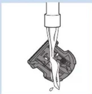 Diagram of a mechanical component with a tool inserted, showing internal structure and part.