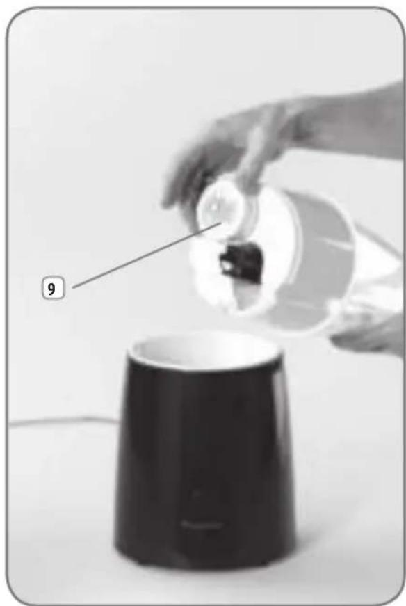 Person pouring liquid from a container into a black cylindrical container (no text or symbols visible)