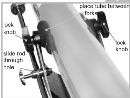 place tube between forks lock knob slide rod through hole lock knob