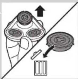 Illustration of a hand holding a brush with an arrow indicating direction, next to a circular object and a small object (no text or symbols)
