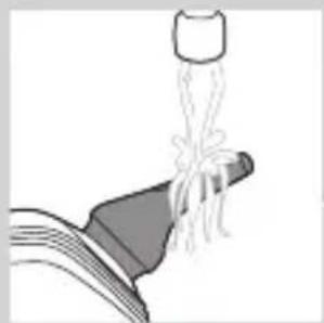 Illustration of a faucet pouring liquid into a pipe (no text or symbols)