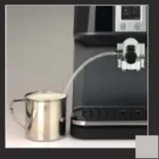 Close-up of a stainless steel kettle next to a black appliance with a piping bag (no visible text or symbols)